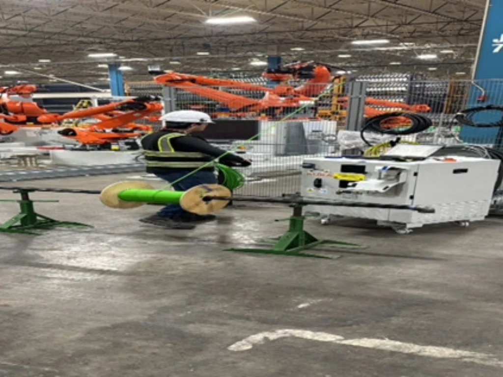 Engineer overseeing automated machinery and electrical systems during Gestamp installation